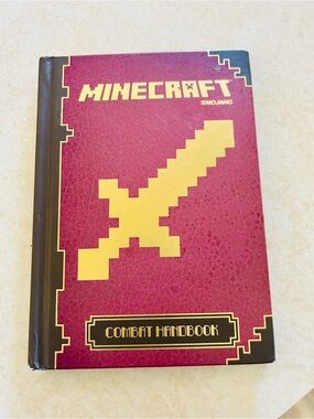 (3/$10) Minecraft Combat Handbook - Mojang Red & Yellow Hardcover Guide